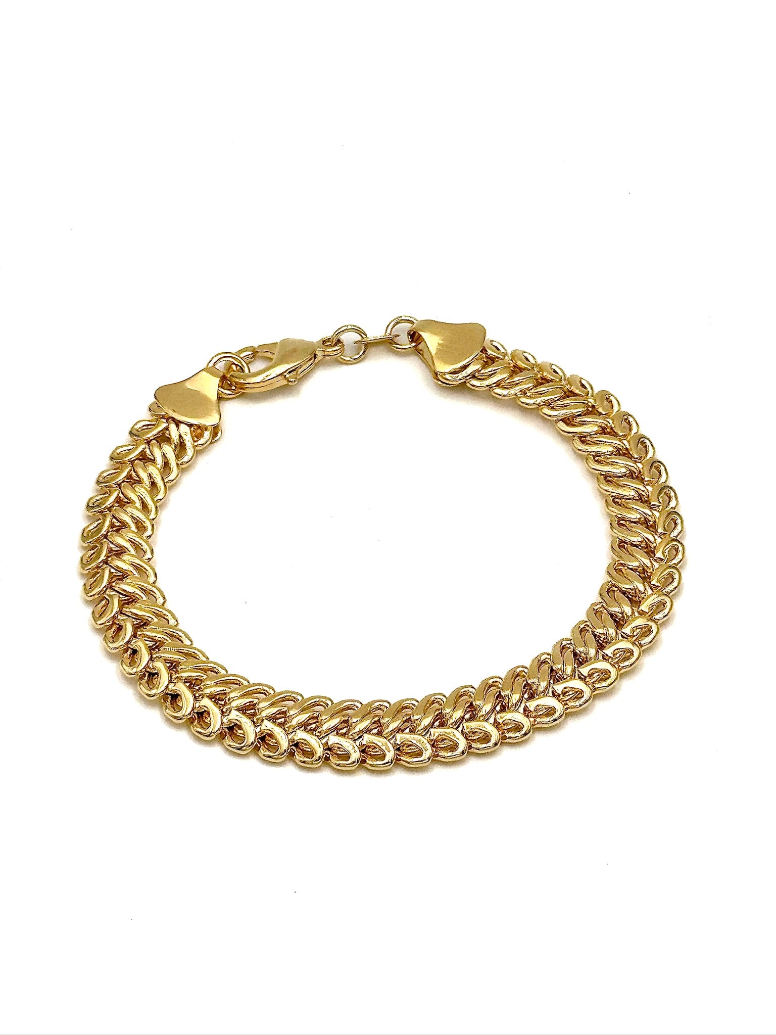 Benthany bold gold-tone woven link bracelet with decorative end caps and lobster clasp arranged in a circle on a white background