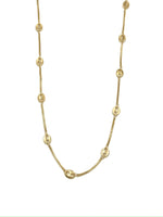 Gold chain necklace on a white background