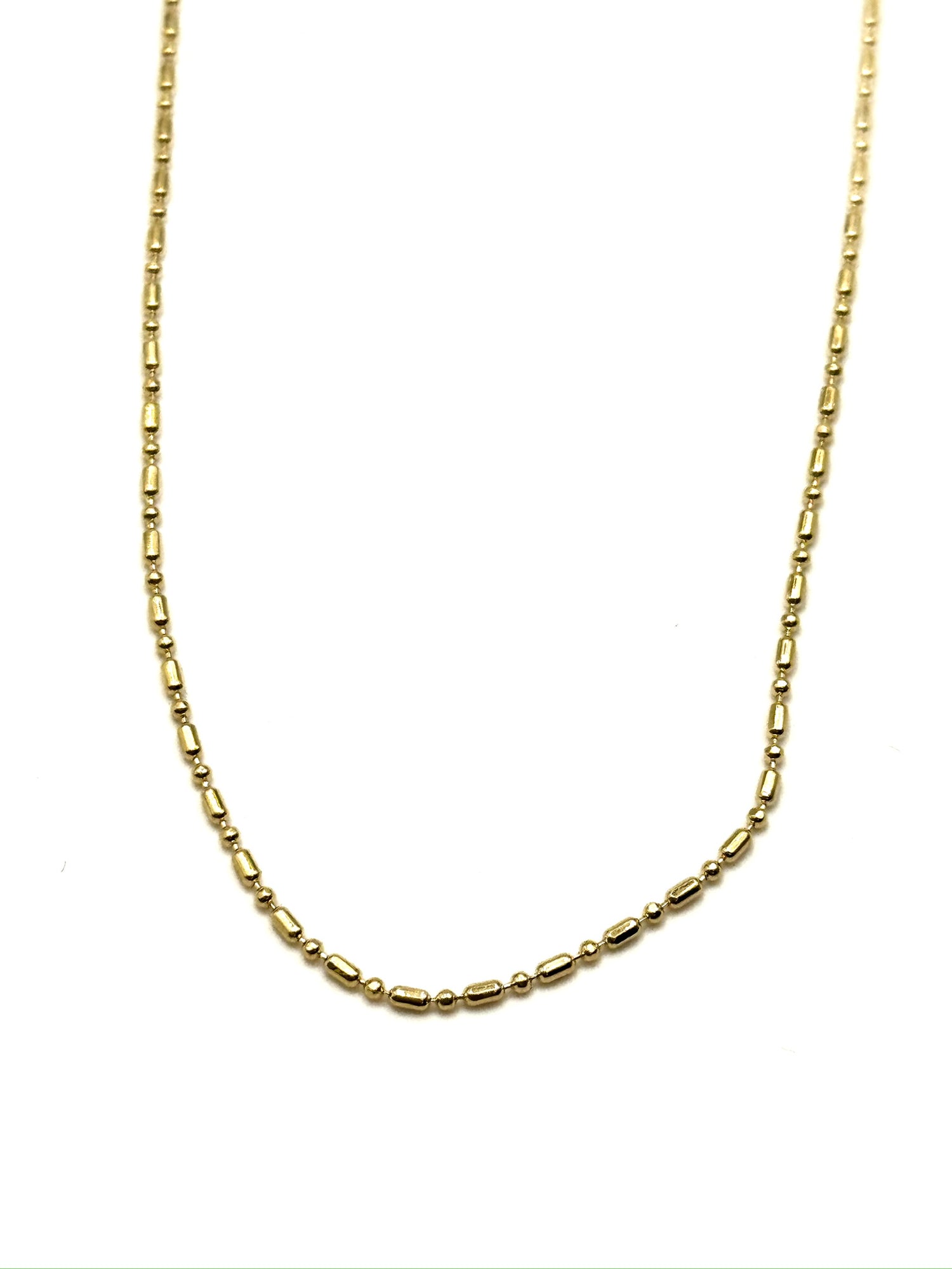 Gold chain necklace on a white background