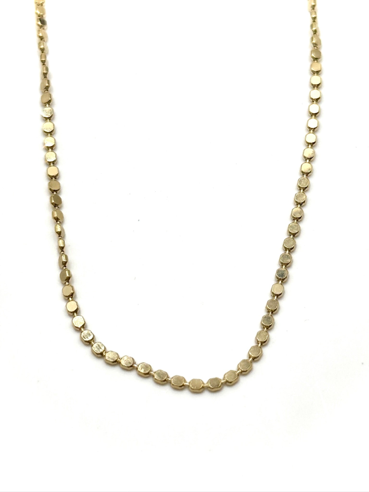 Gold necklace on a white background