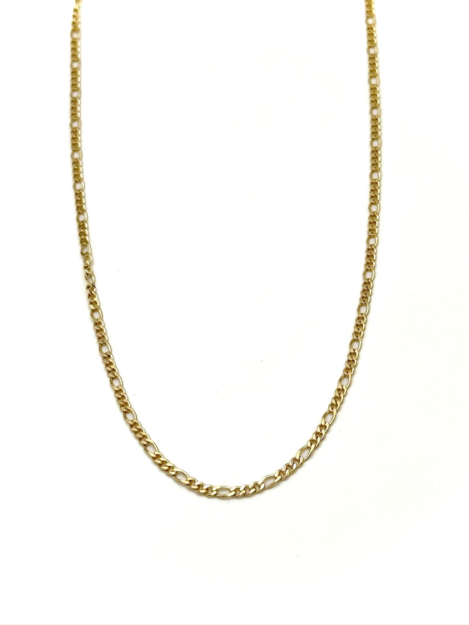 Gold chain necklace on a white background