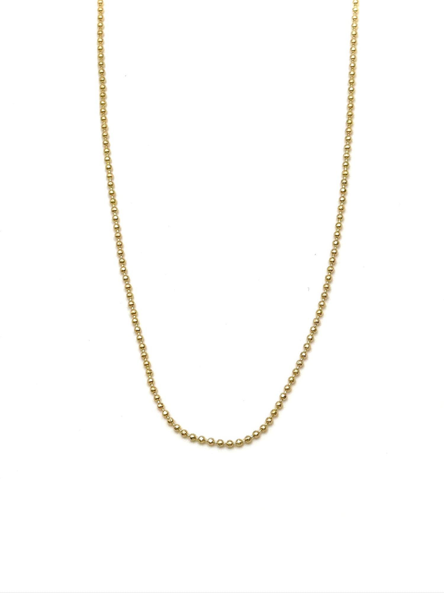 Gold chain necklace on a white background