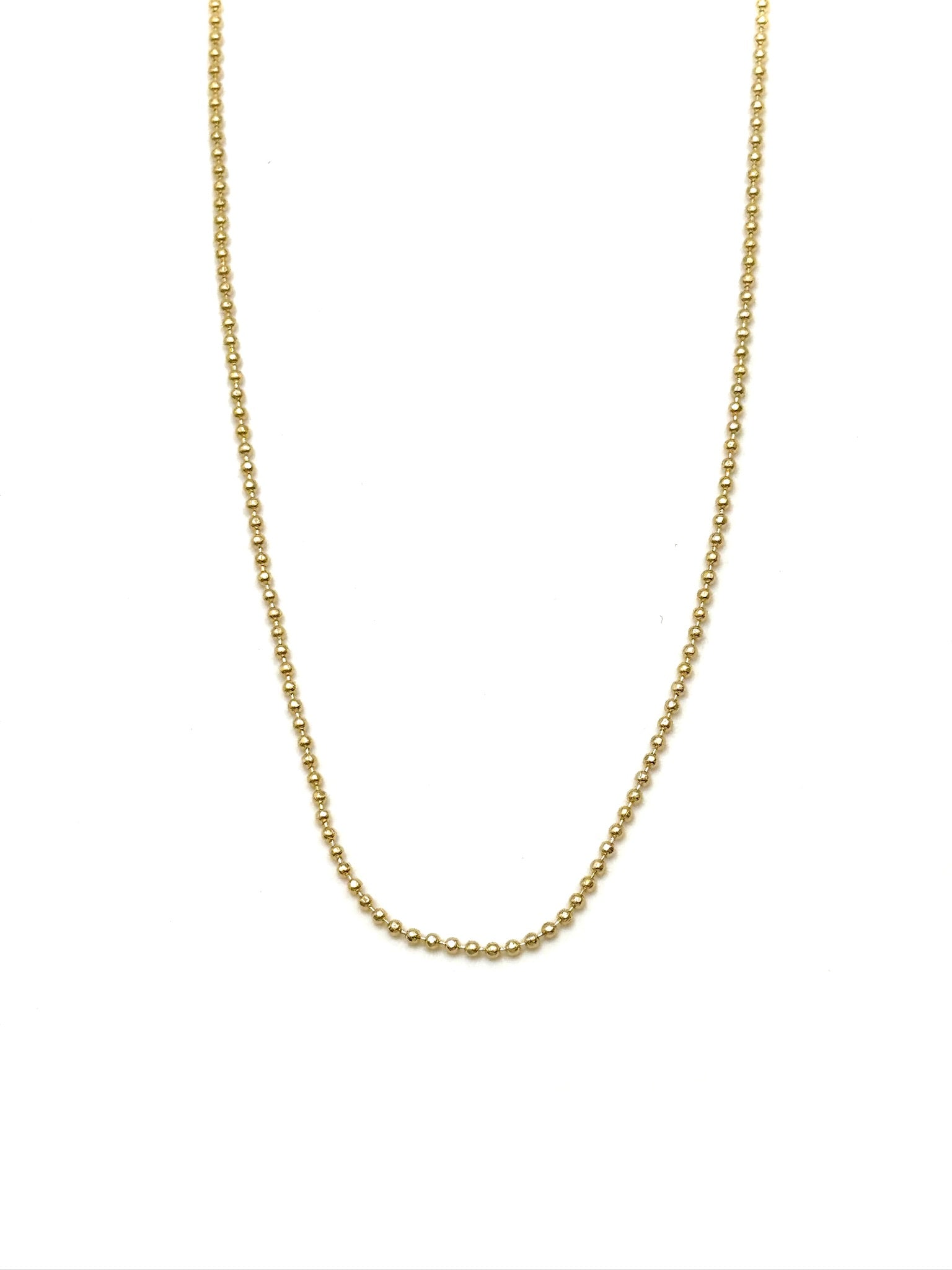Gold chain necklace on a white background
