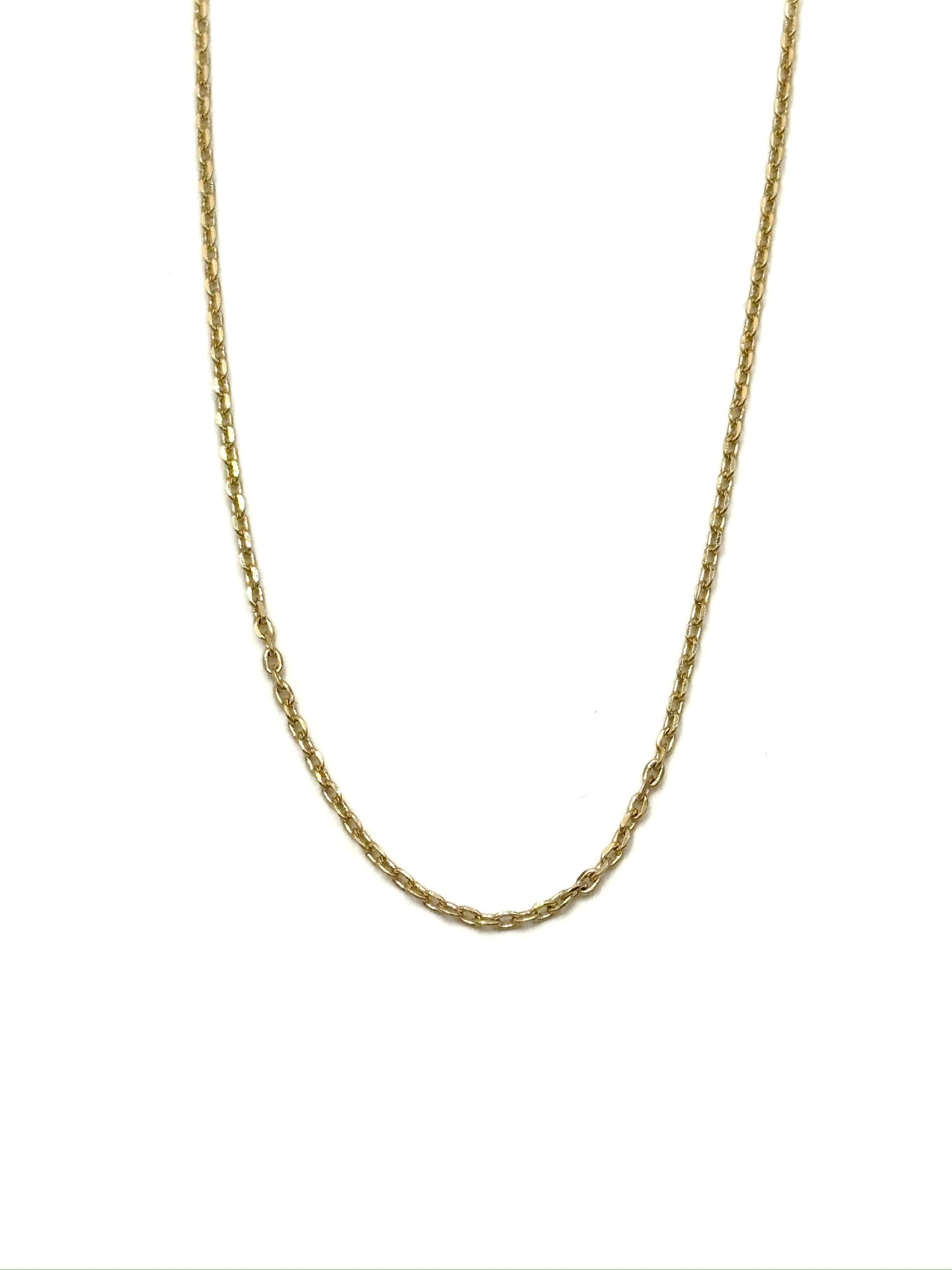 Gold chain necklace on a white background