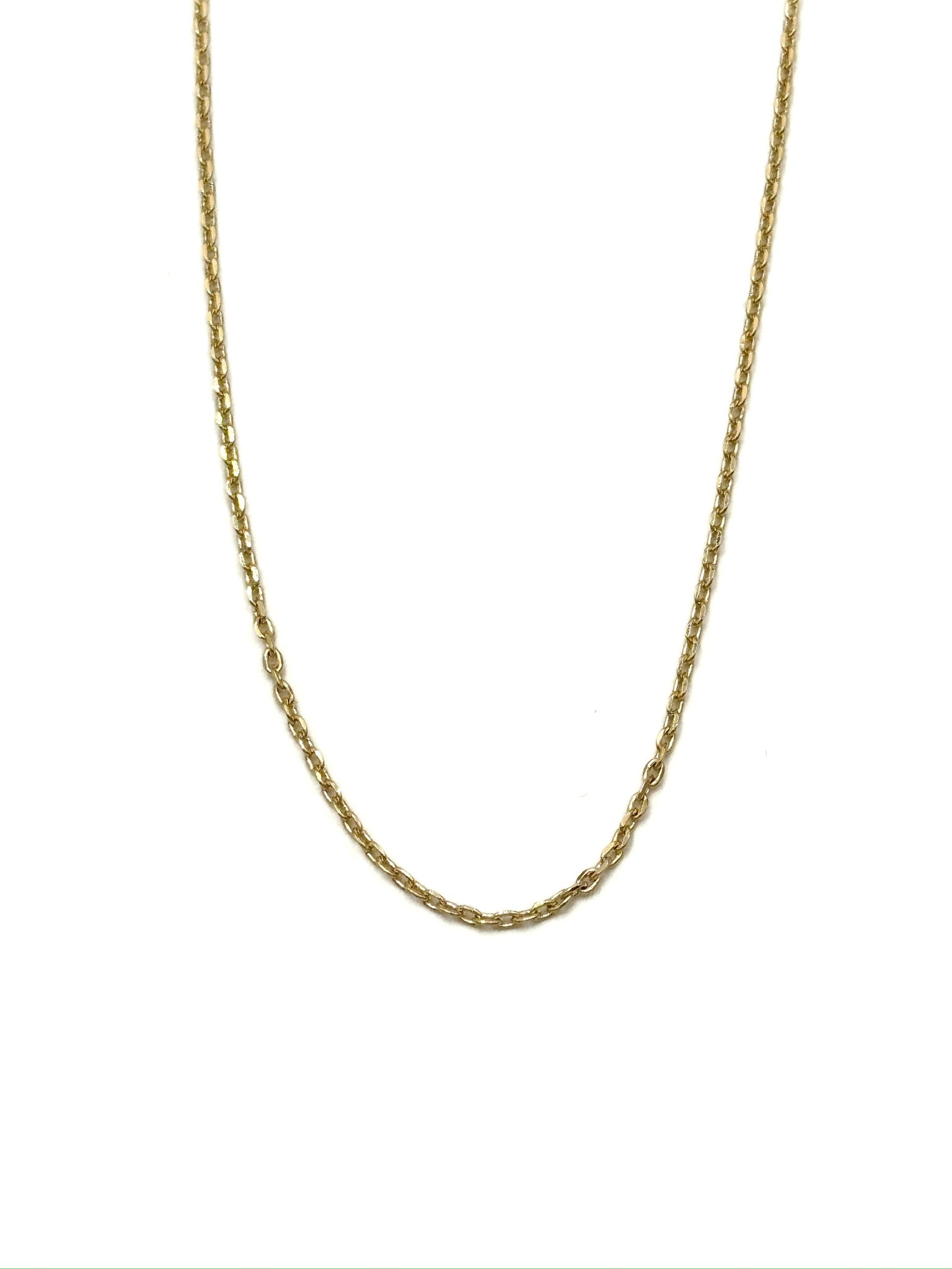 Gold chain necklace on a white background
