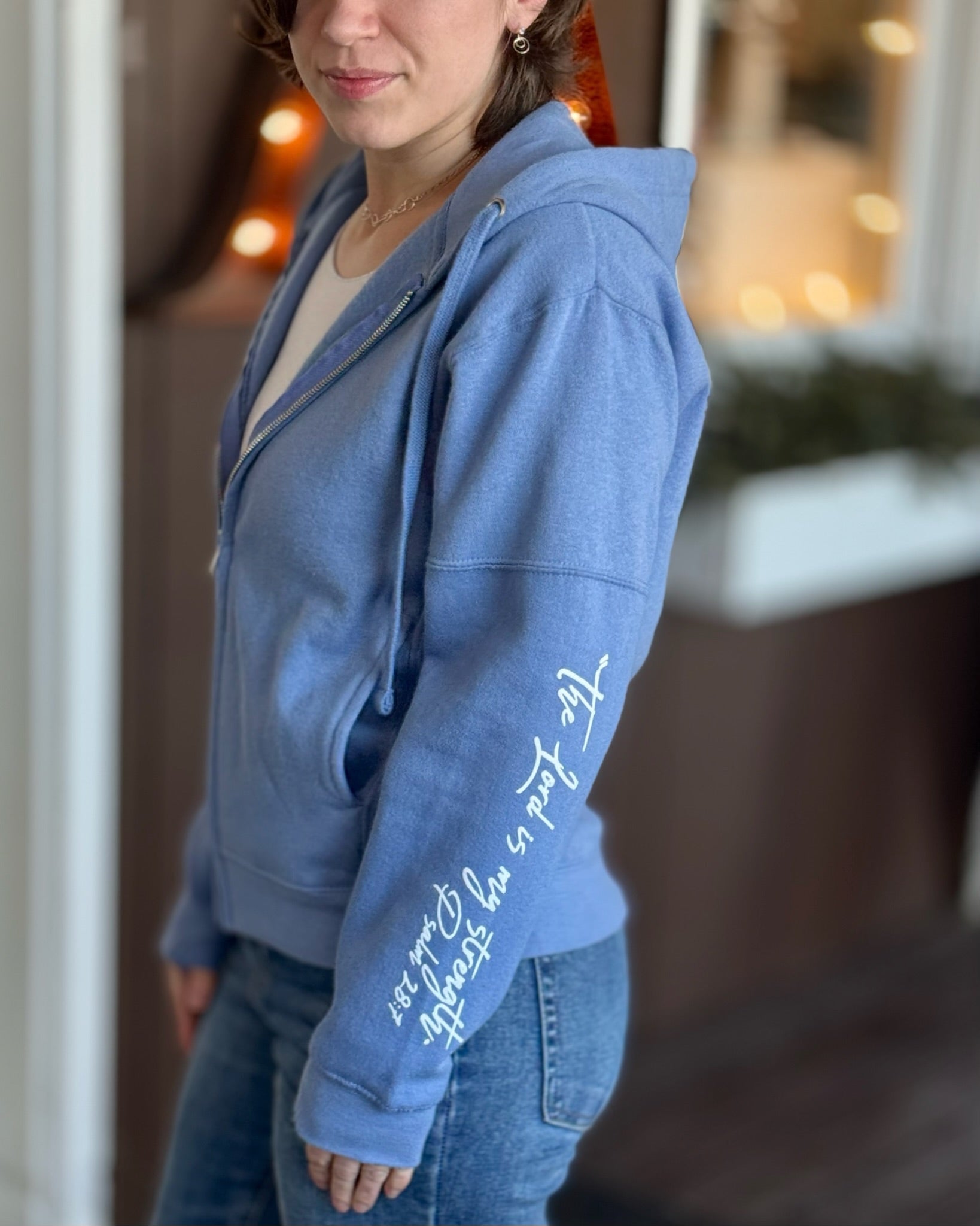 Woman wearing scripture on sleeve hoodie