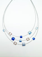 triple-layer necklace with square accents in cool blues with metallic open frames