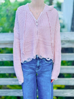 Kennedy Hoodie in blush with an open knit design, hood, ring zipper and distressed trim styled with denim at Ardor Boutique.