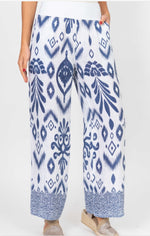 Close-up of Brynn Italian linen navy and white geo print pants showing wide-leg silhouette and detailed patterned hem.