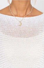 Close-up of Vanda white Italian sweater showing open weave knit texture and boat neckline detail