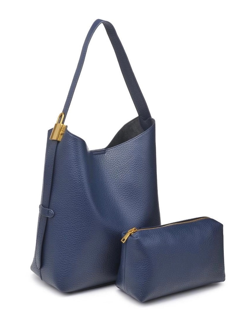 Navy handbag with matching pouch on a white background