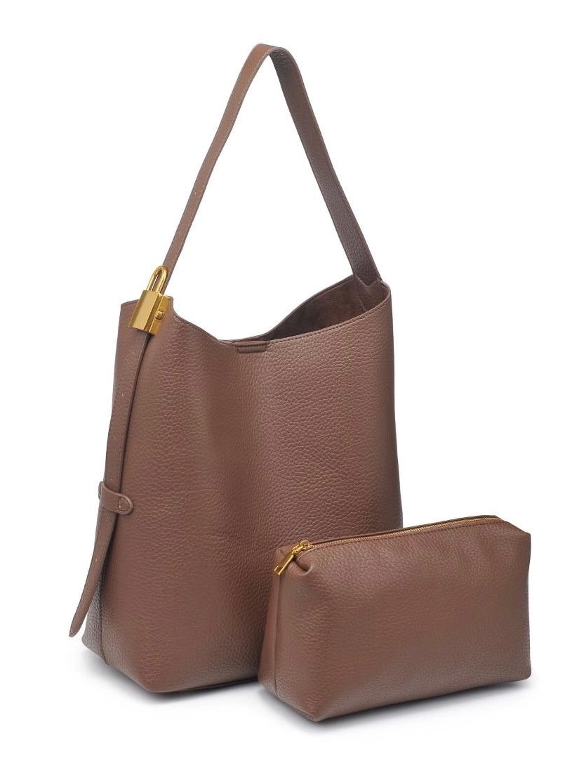 Brown leather handbag with matching pouch on a white background