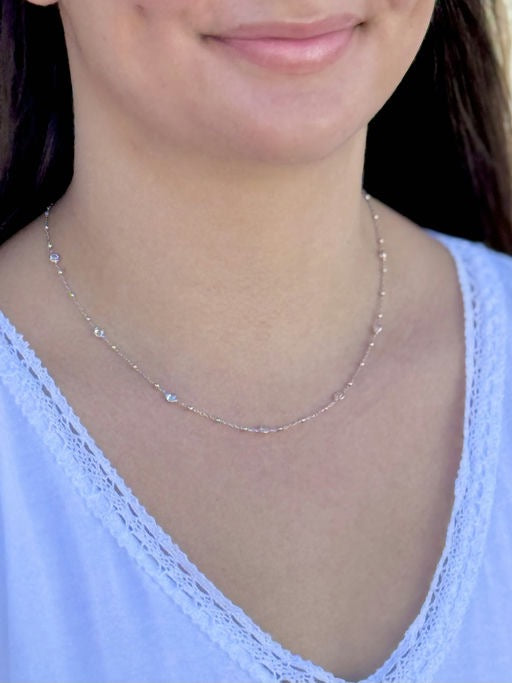 Necklace worn by a person with a blurred background