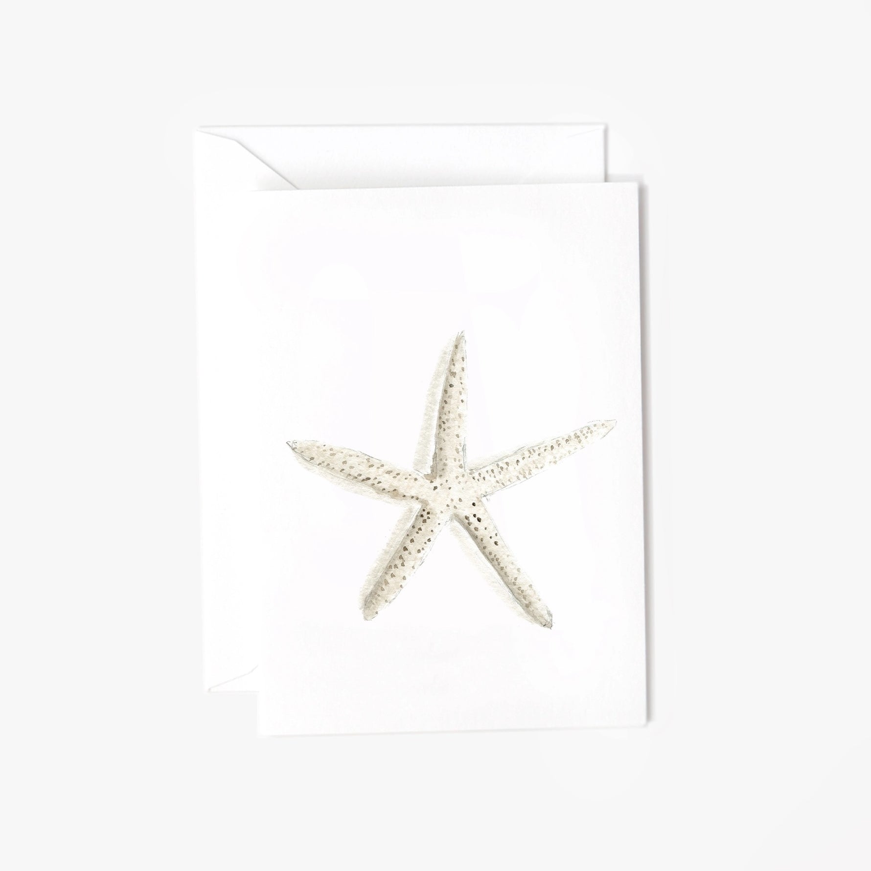 Mini notecard with watercolor starfish illustration on white cardstock, paired with a matching envelope.