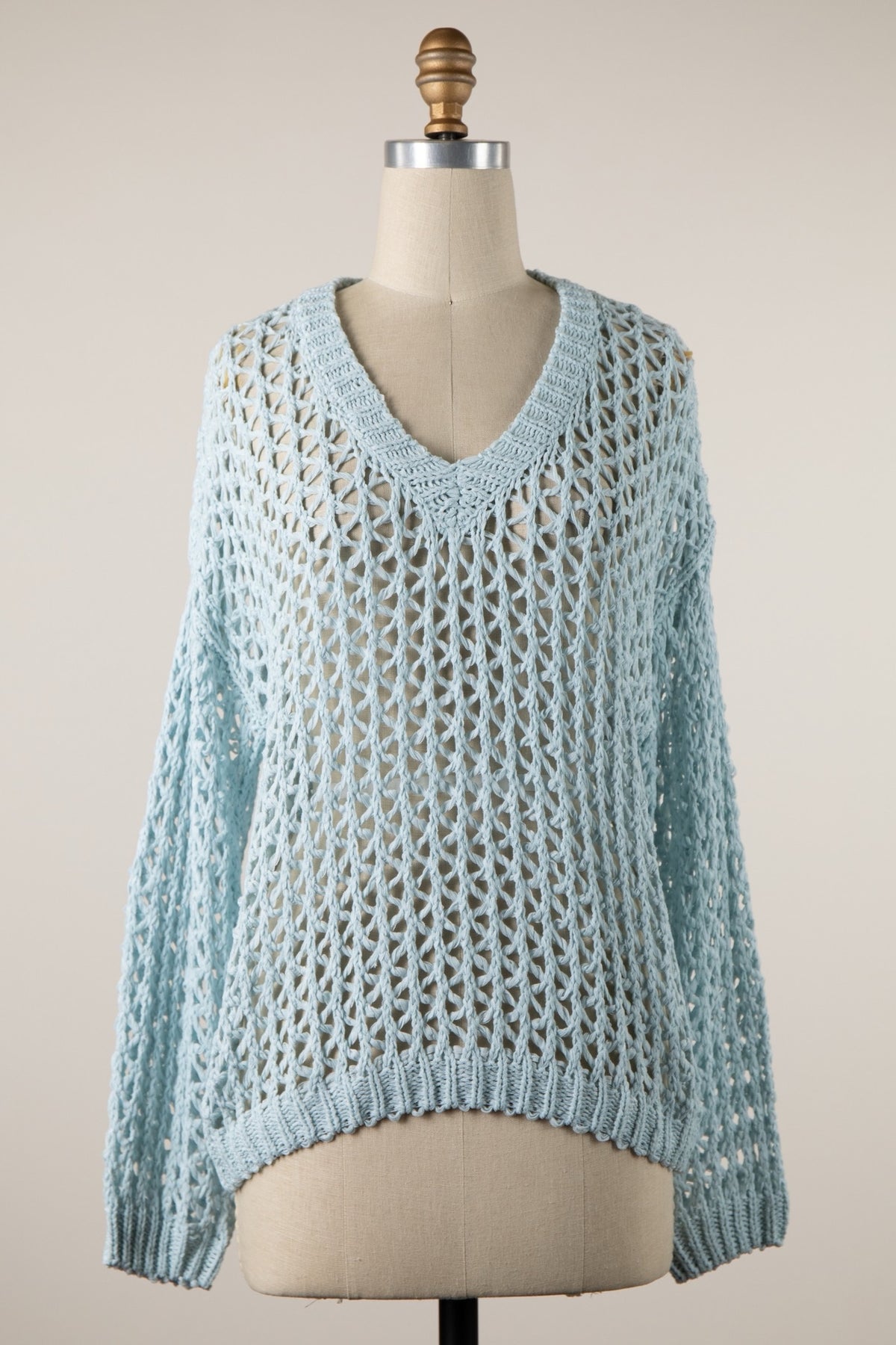 Soft aqua blue open knit sweater with a V-neckline, long sleeves and relaxed fit at Ardor Boutique.