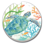 Round coaster with a turtle design surrounded by fish and coral on a white background