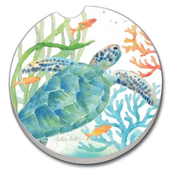 Round coaster with a turtle design surrounded by fish and coral on a white background