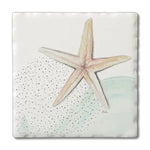 Starfish and faint wave design on a coaster with a white background