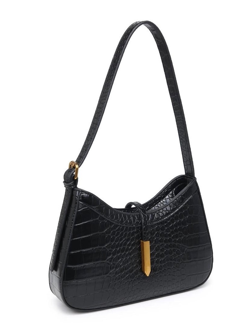 Black handbag with a gold accent on a white background