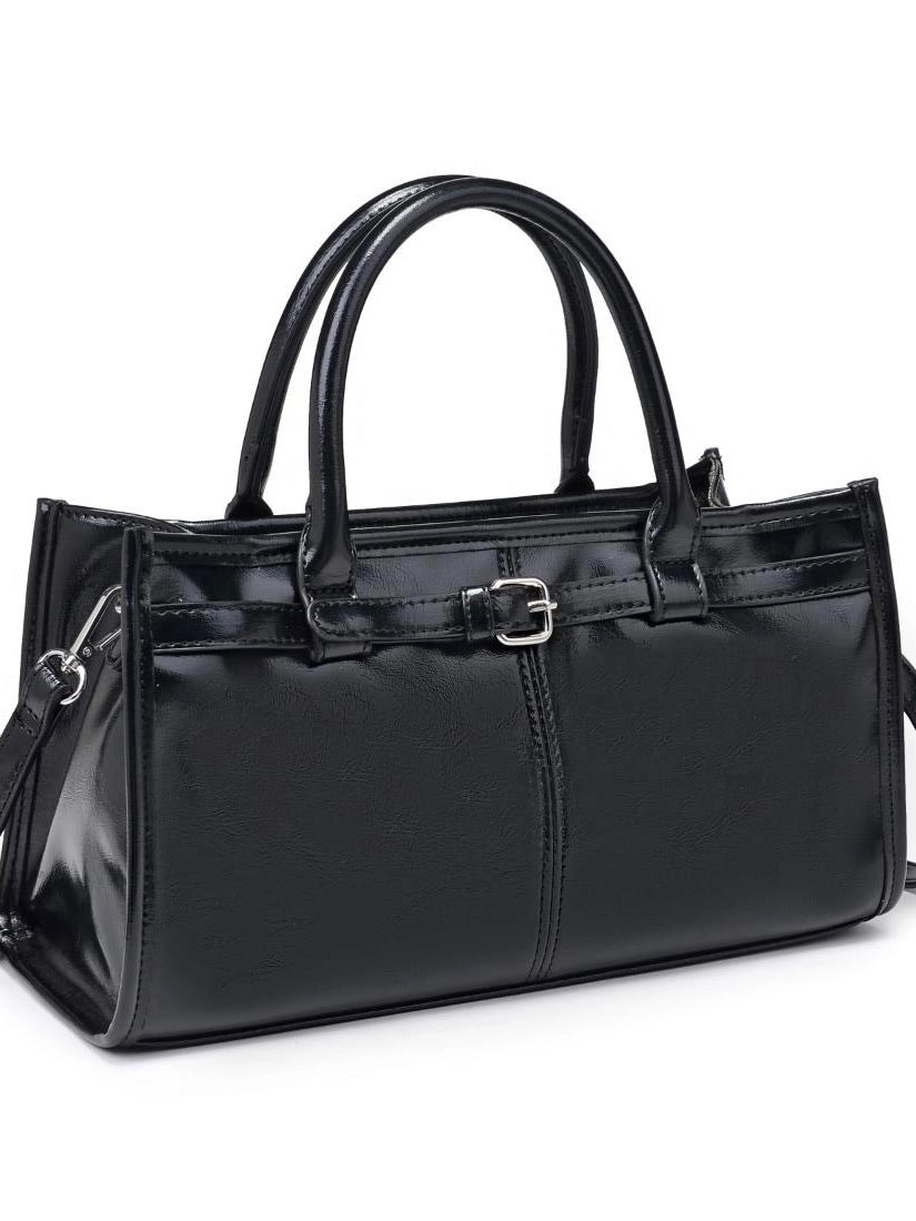 Black handbag with a buckle on a white background