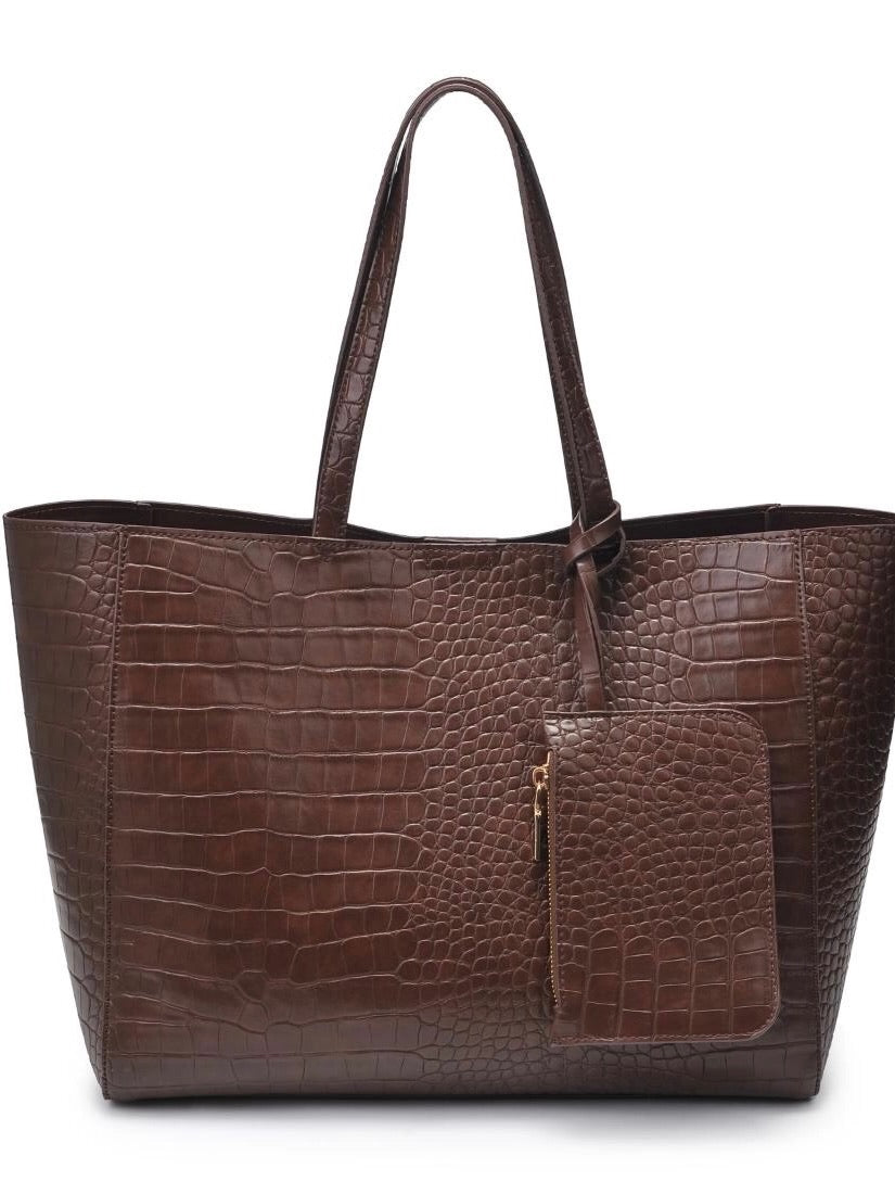 Brown crocodile-patterned handbag on a white background