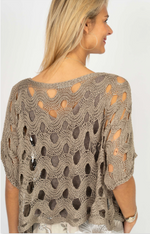 Back view of knit top In taupe