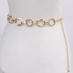 Gold circular link chain belt with smooth and textured rings styled at the waist at Ardor Boutique.