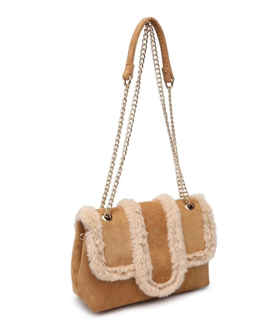 Tan handbag with fur trim and chain strap on a white background (front view)