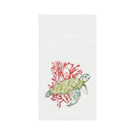 White towel with a green turtle and red coral design on a white background