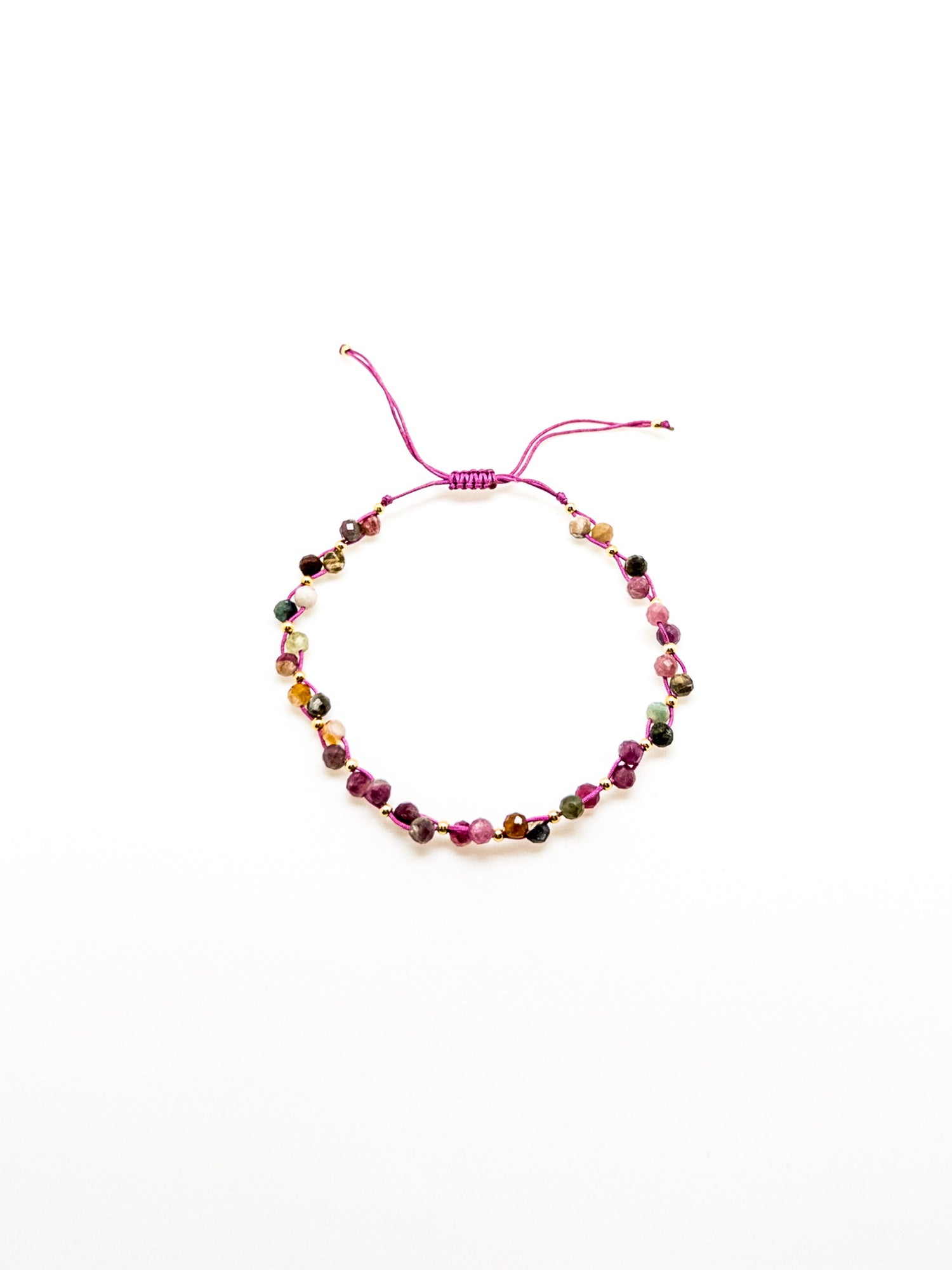 An adjustable tourmaline bracelet with a purple and green tones