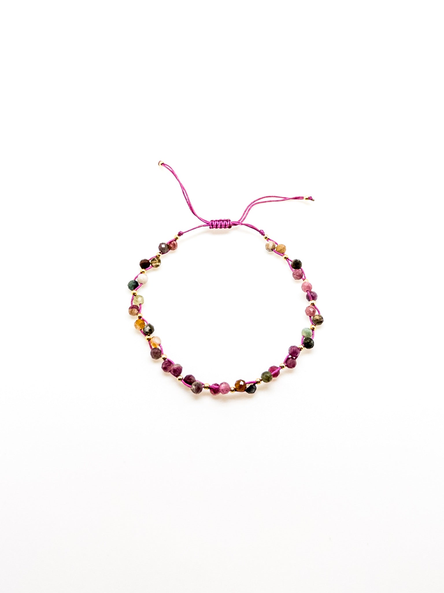 An adjustable tourmaline bracelet with a purple and green tones