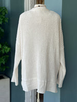Back view of the Isabelle Sweater Cardigan in ivory cream showing the cozy waffle-knit texture