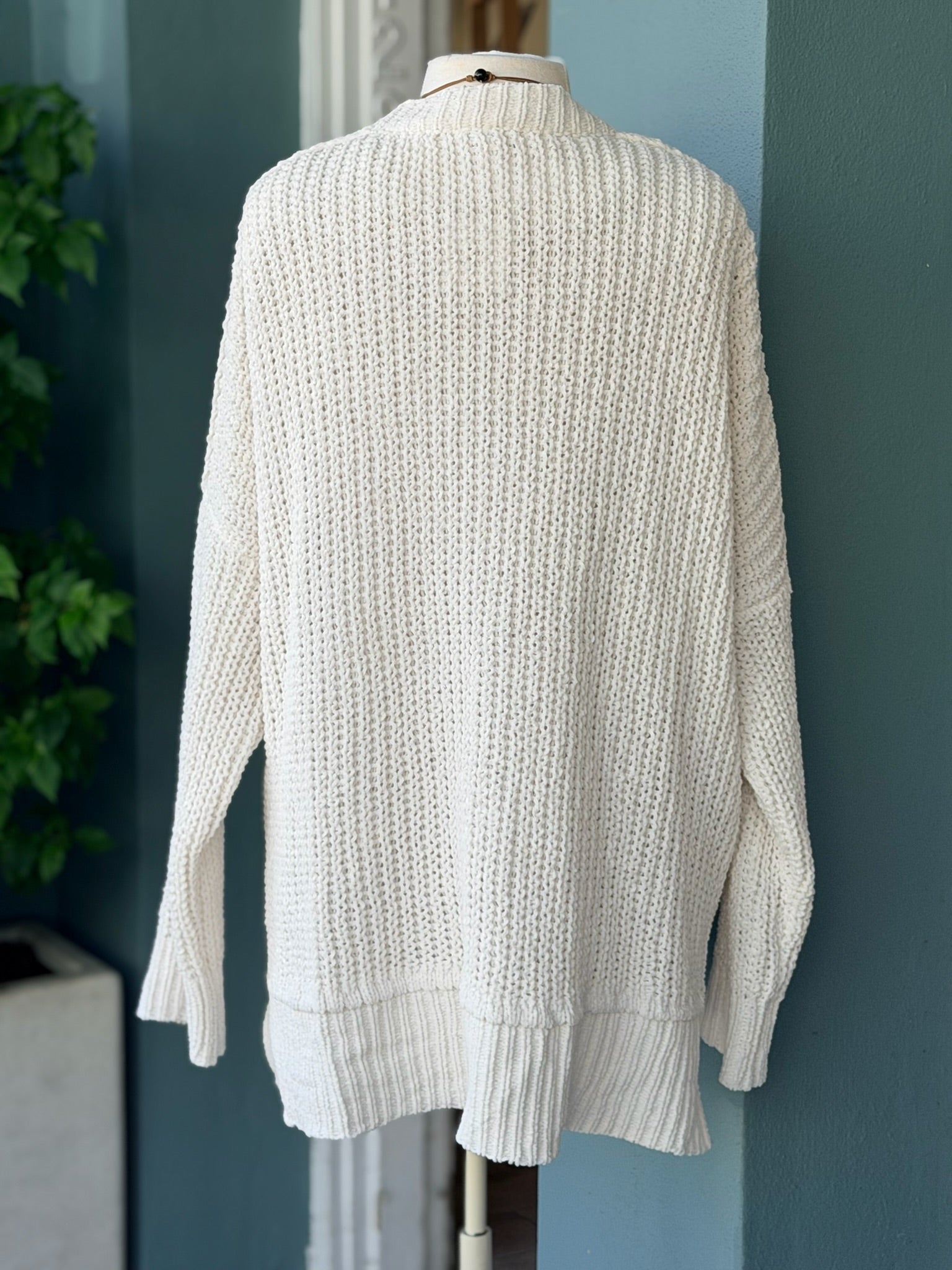 Back view of the Isabelle Sweater Cardigan in ivory cream showing the cozy waffle-knit texture