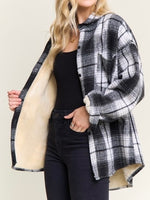 Shown on model: Interior view of plaid shacket showing cozy cream sherpa lining