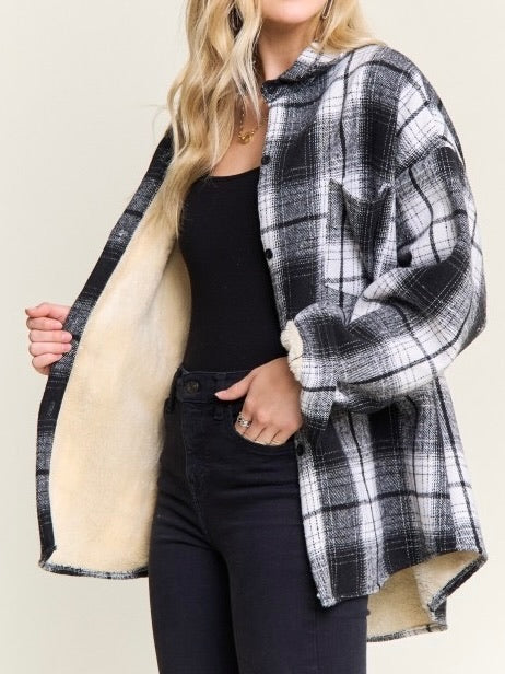 Shown on model: Interior view of plaid shacket showing cozy cream sherpa lining