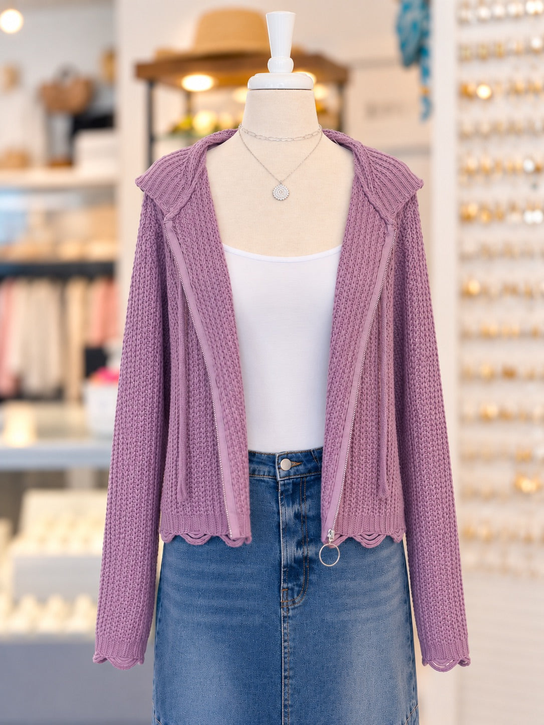 Kennedy Hoodie in dusty lavender featuring a textured open knit, full zipper with ring pull, drawstring hood, and scalloped hem, styled with denim at Ardor Boutique.