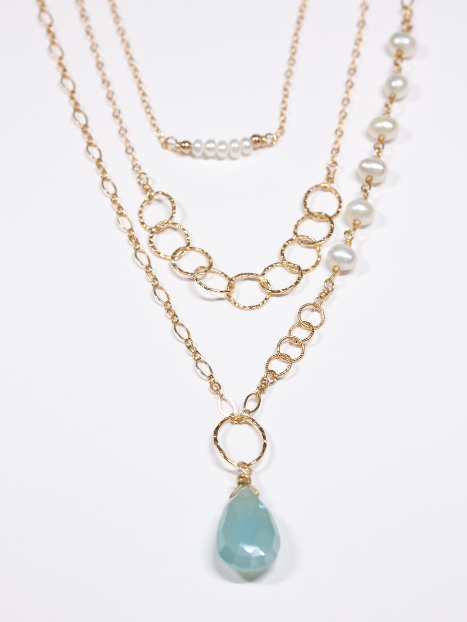 Flat-lay of Layered gold necklaces using magnetic layering clasp 