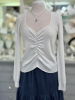 Mannequin shown with nh jewelry and a layering clasp for tangle free looks.