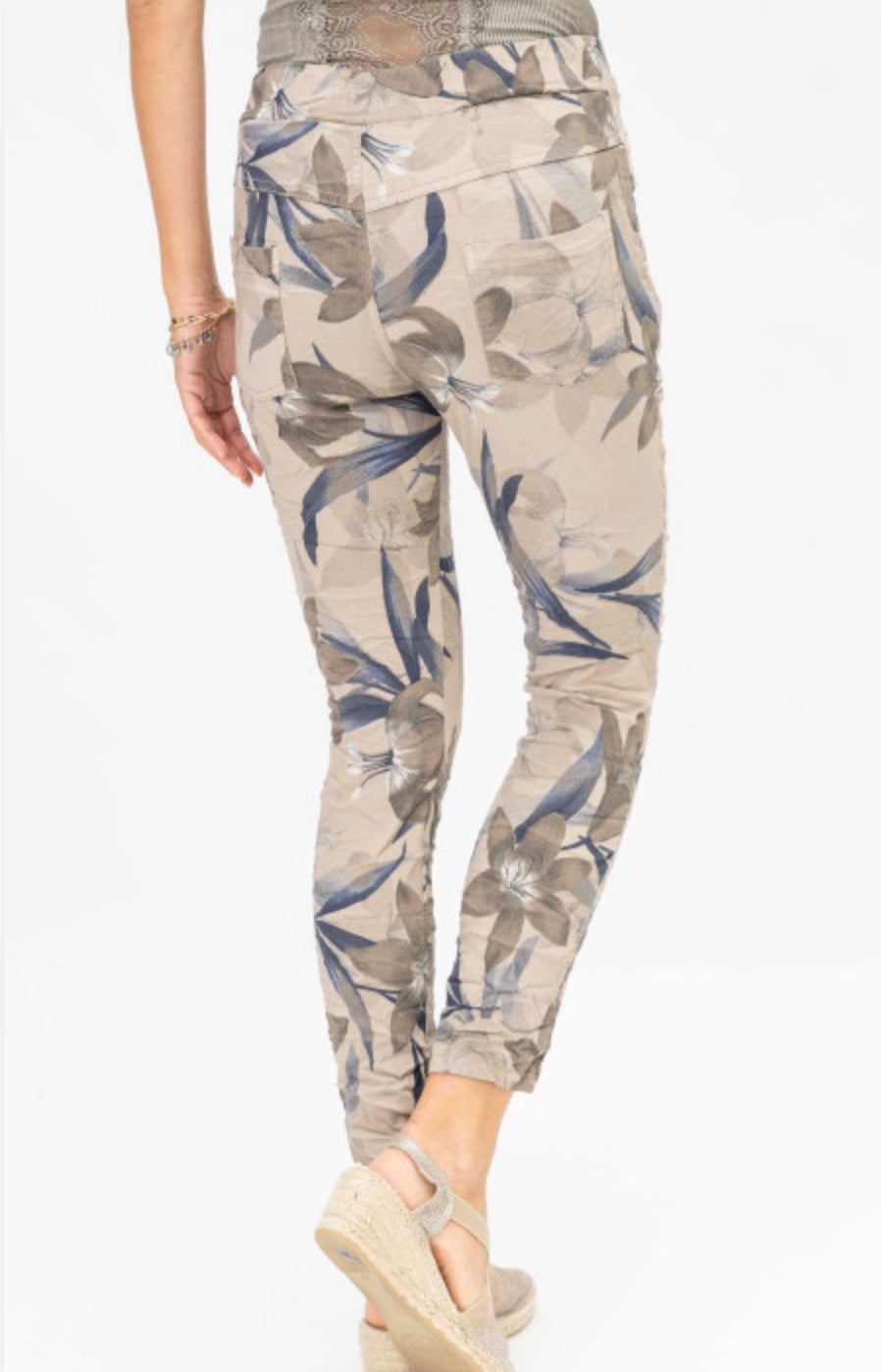 Back view of Megan Floral Pants in Brown showing floral print and relaxed crinkle fabric at Ardor Boutique