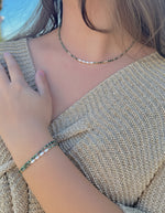 Model wearing Isla African Turquoise & Freshwater Pearl Necklace and coordinating bracelets