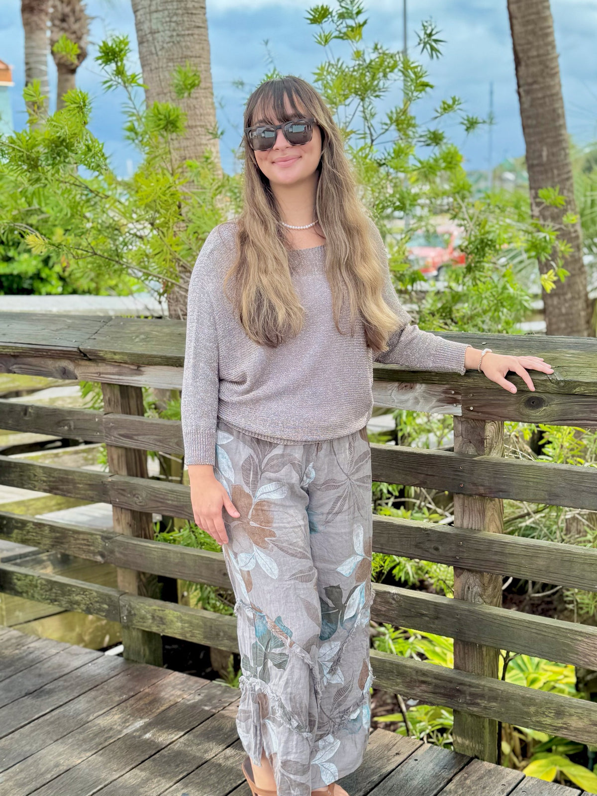 Model wearing Briella taupe shimmer sweater with relaxed dolman sleeves and metallic knit