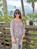 Model wearing Briella taupe shimmer sweater with relaxed dolman sleeves and metallic knit