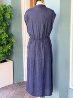 Navy sleeveless linen midi dress with elastic waist shown from back on mannequin