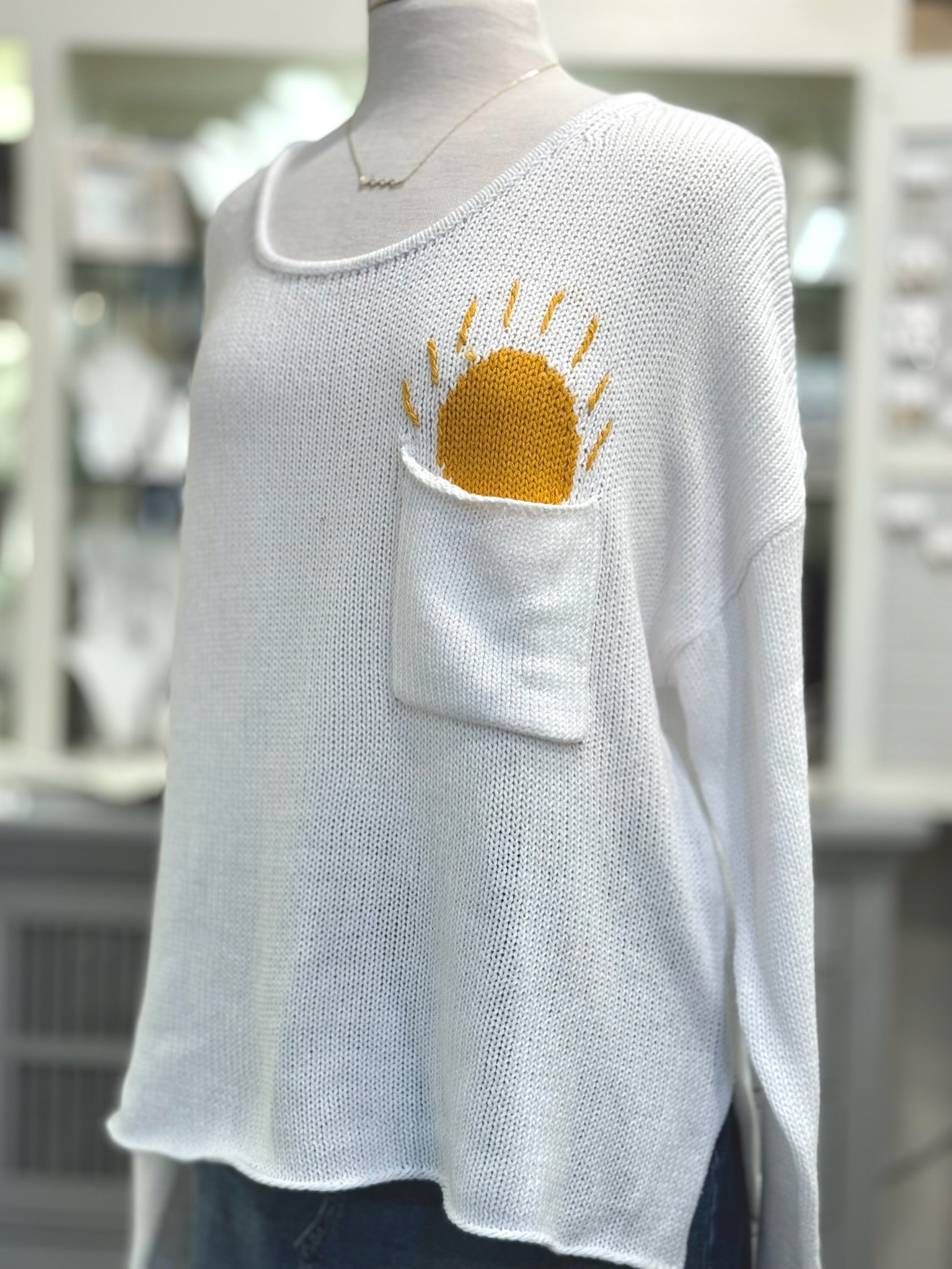 Ivory scoop neck sweater with sun design peeking from chest pocket – Ardor Boutique
