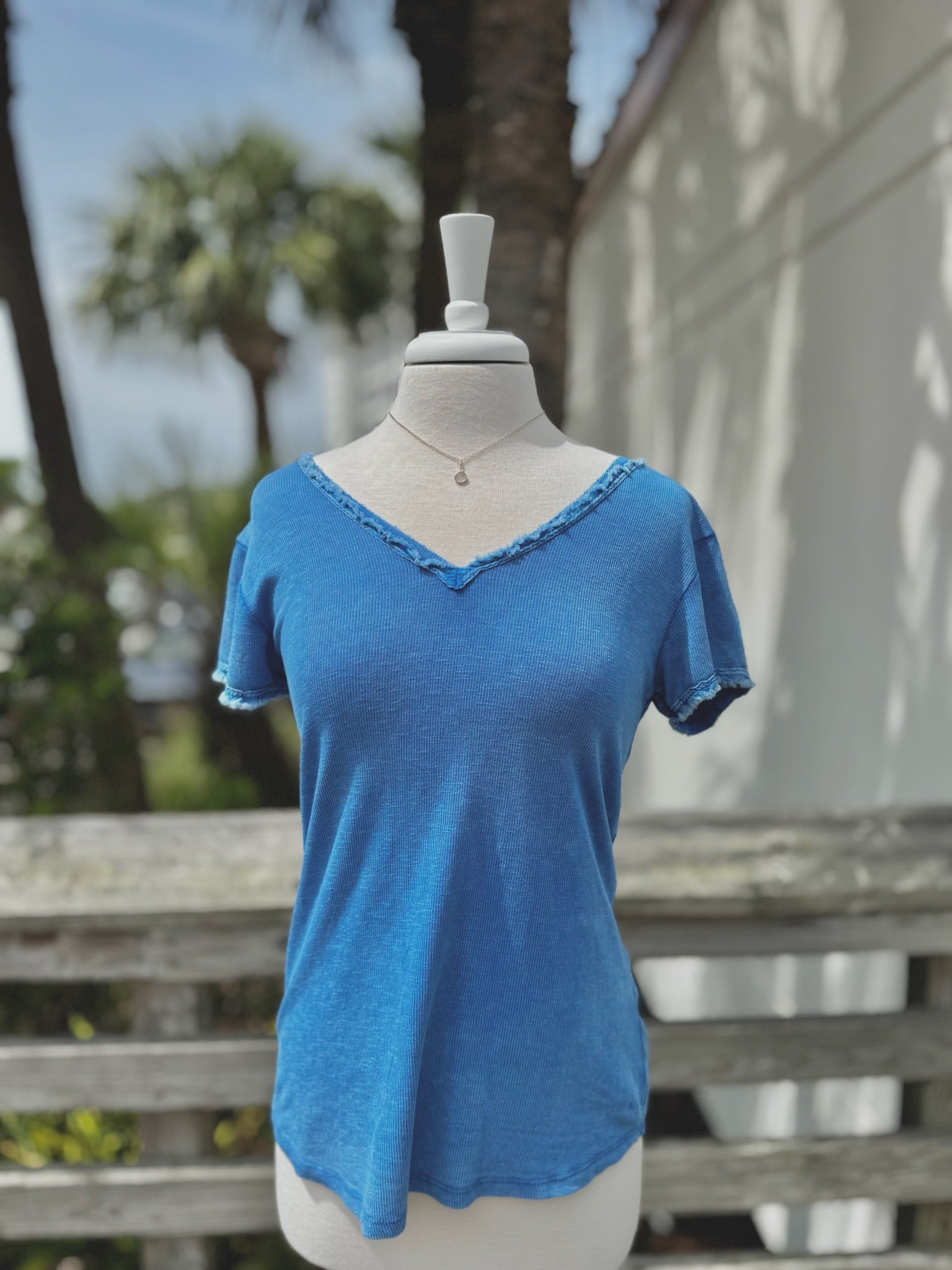 Reece Raw Edge Top in Royal Blue on mannequin
