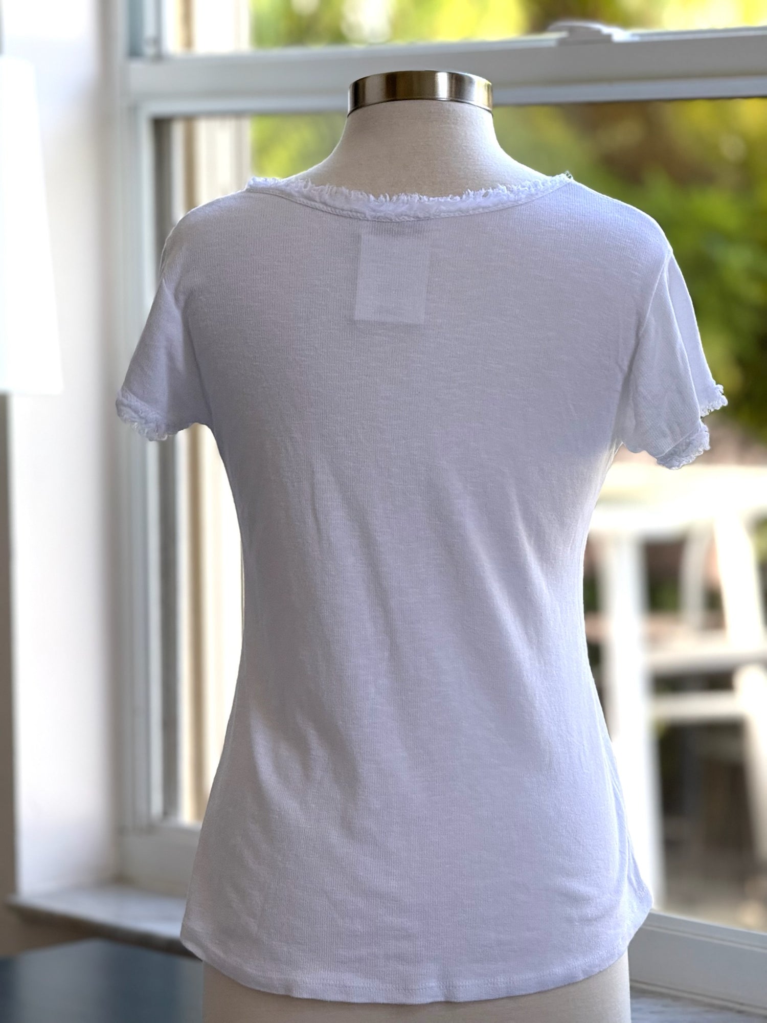 Reece Raw Edge in White (back view on mannequin)