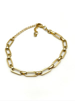 Riley gold-tone paperclip link bracelet with slim rectangular links and extender chain displayed in a circle on a white background