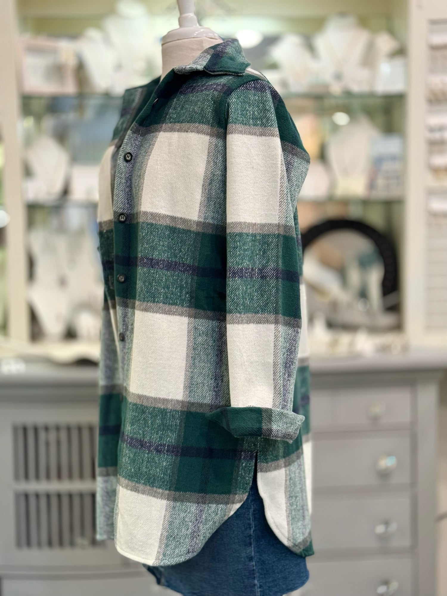 Side view of casual green check shacket for women with pockets.