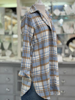Side view of women’s layering shacket in blue and tan plaid pattern.
