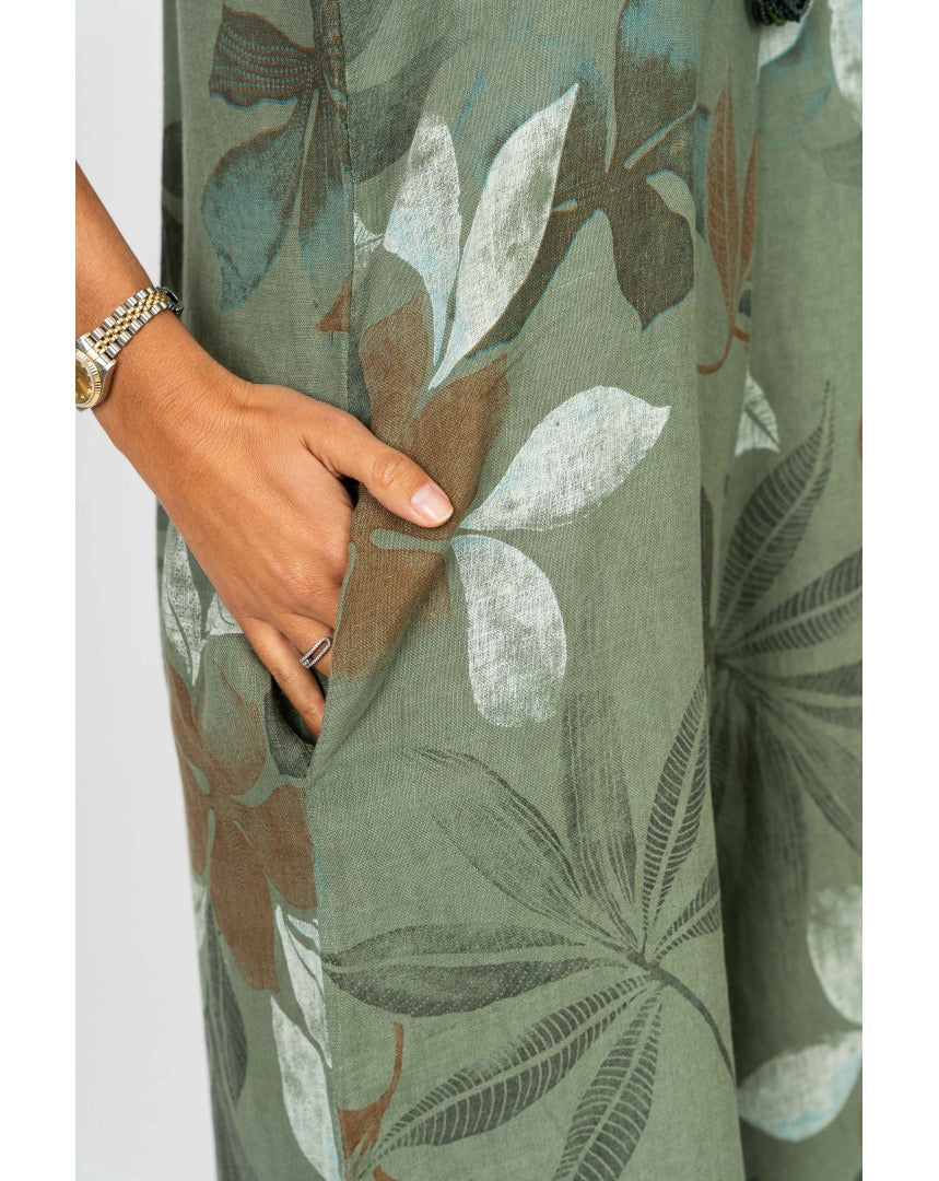 Close-up of pocket and floral print on the Sienna Leaf Print Romper in Olive